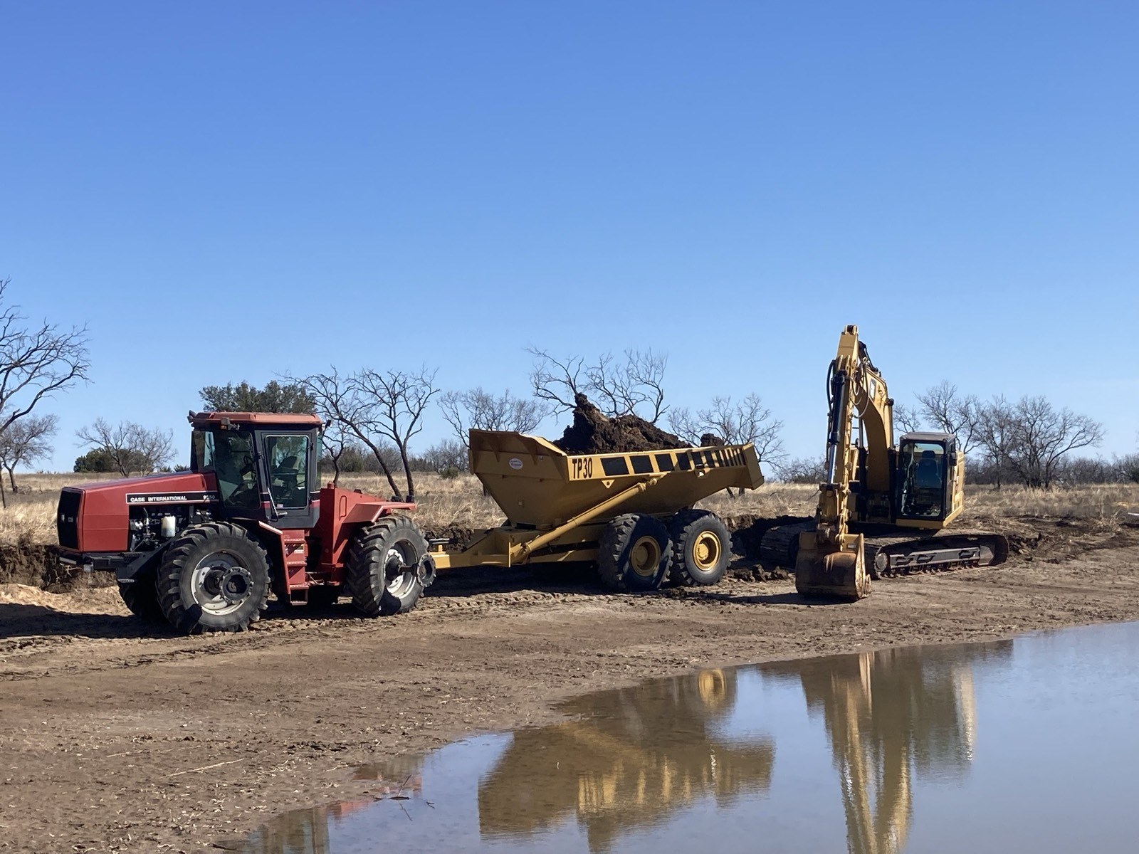 Equipment working near a completed water feature