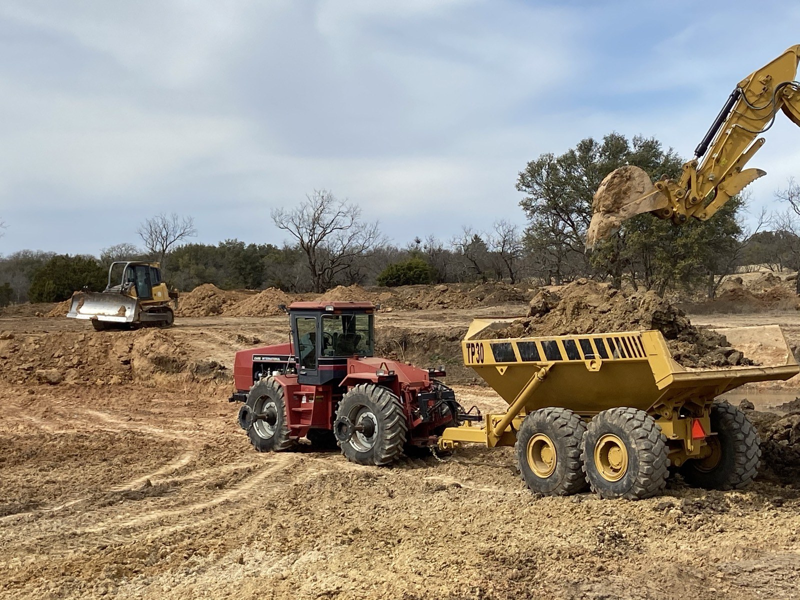 Multiple pieces of equipment working one job site