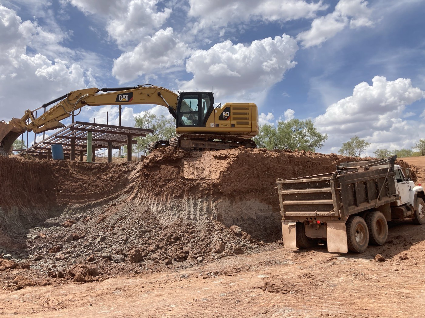 Excavator loading a dump truck