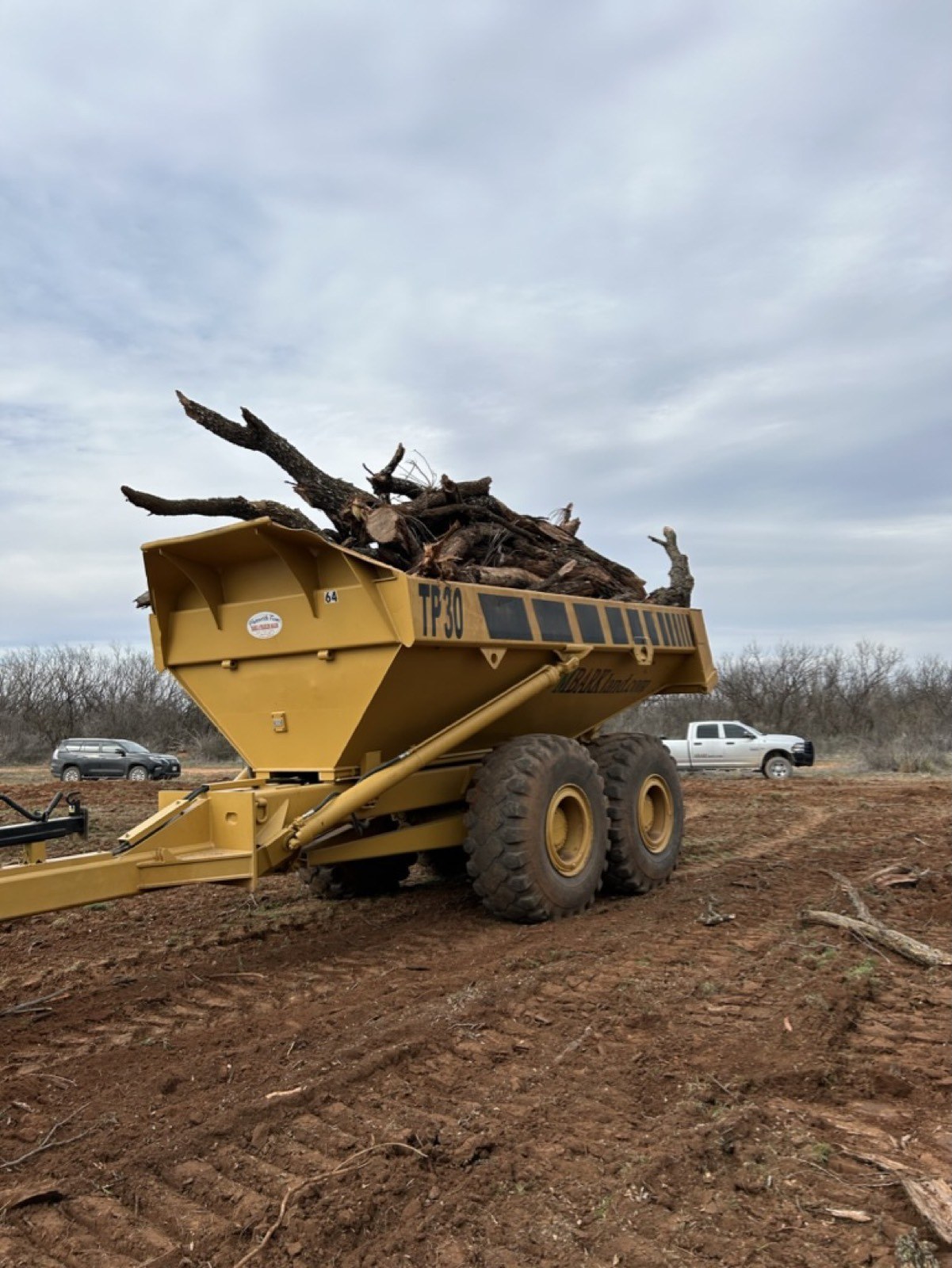 MBARK dump wagon loaded with cleared brush